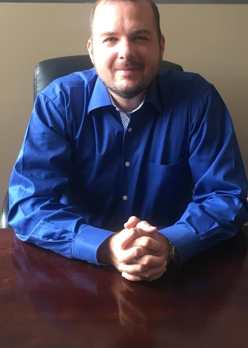 Attorney Michael J. Letsen seated at his desk
