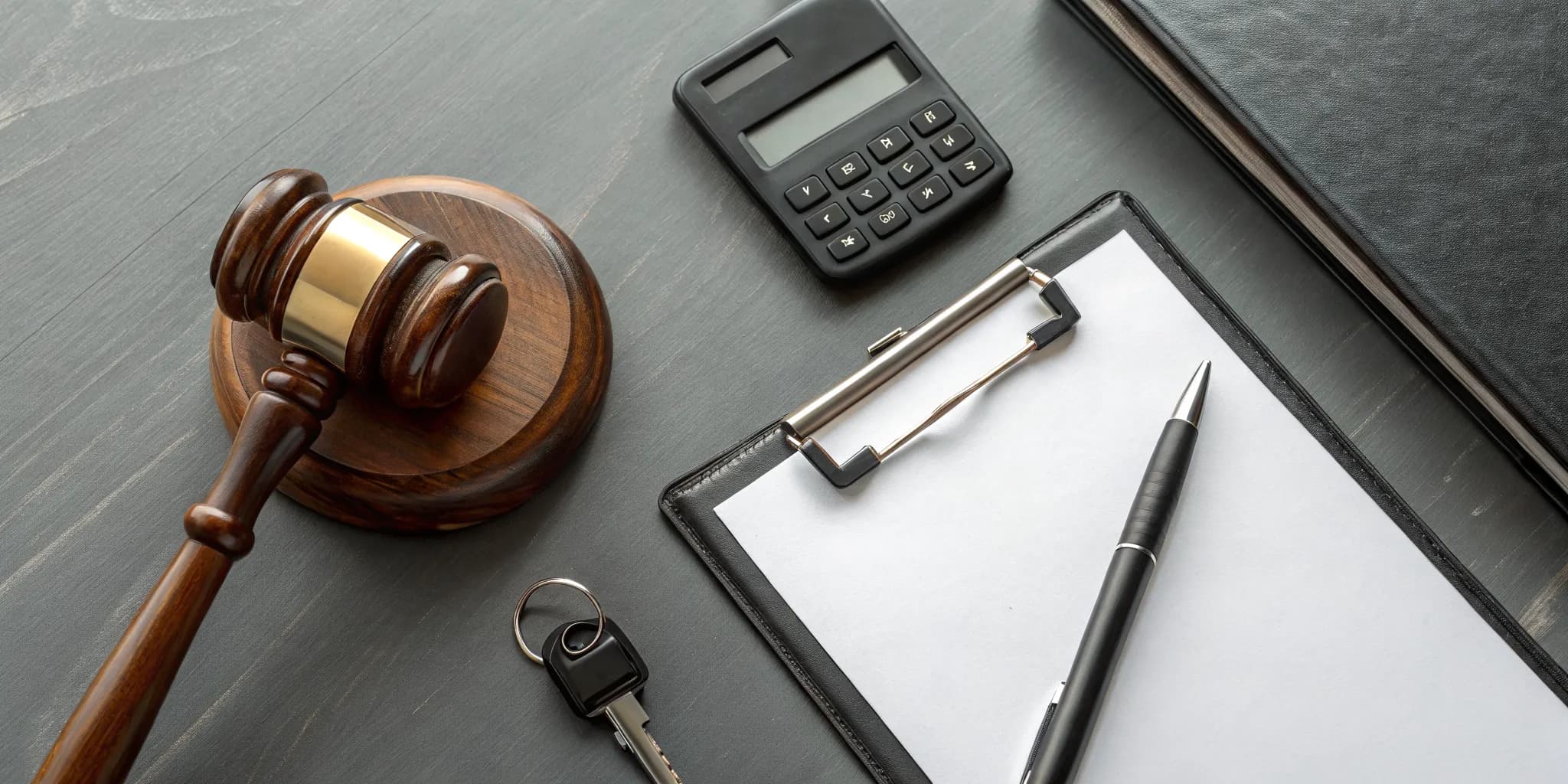 Gavel and calculator showing what happens when you get a reckless driving ticket.
